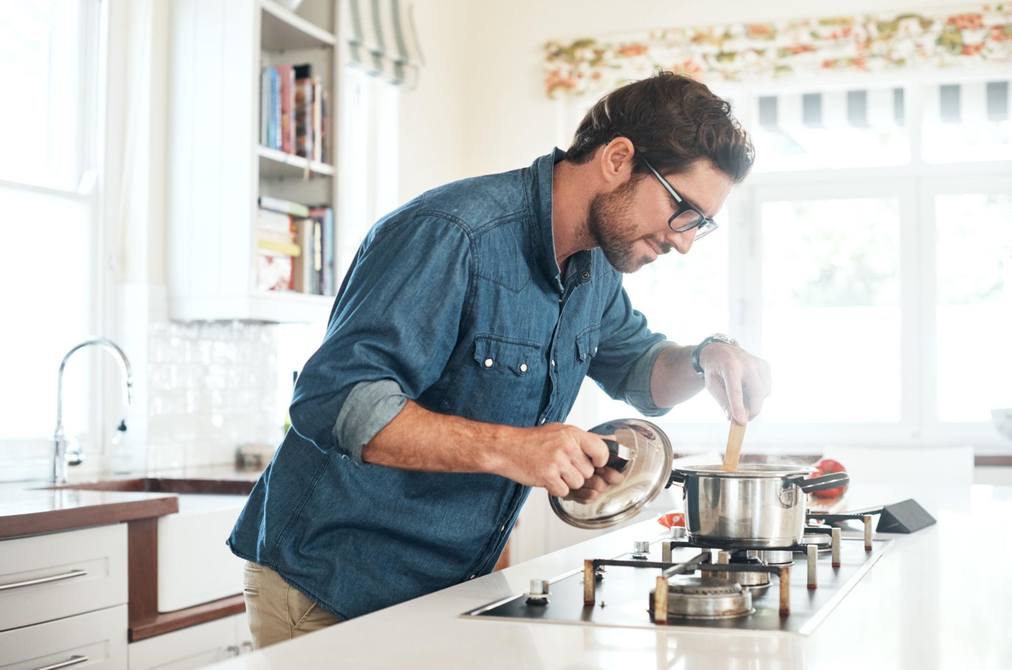 Man cooking at home in a quiet everyday moment